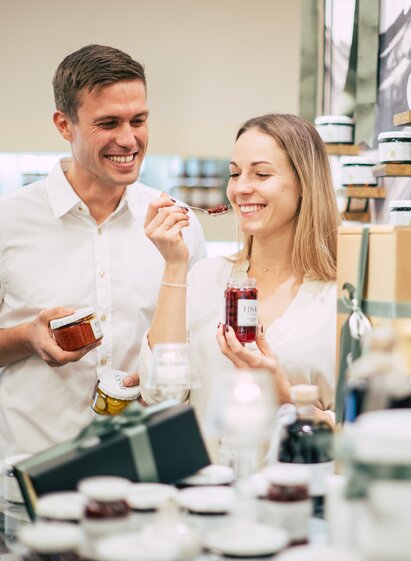 Couple tasting jams and chutneys at Finks Delikatessen in Southeast Styria