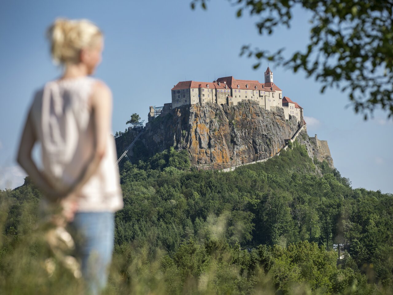 Woman enjoying the view of the Riegersburg Styrian Castle Road