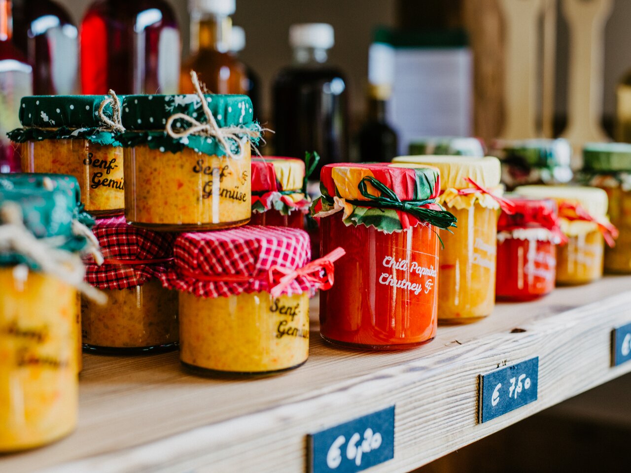 Homemade chutneys, mustards and regional specialties displayed on the shelves of Danis Genussecke in Graz