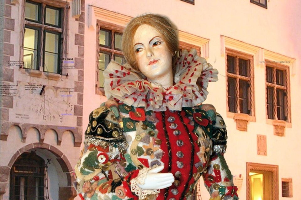 Das Flinserl vor dem Kammerhofmuseum. Der Hintergrund zeigt architektonische Details aus der Vergangenheit.</p> | © Kammerhofmuseum Bad Aussee
