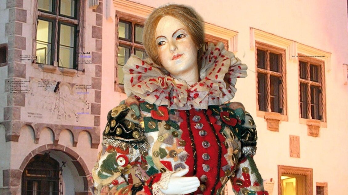 Das Flinserl vor dem Kammerhofmuseum. Der Hintergrund zeigt architektonische Details aus der Vergangenheit.</p> | © Kammerhofmuseum Bad Aussee