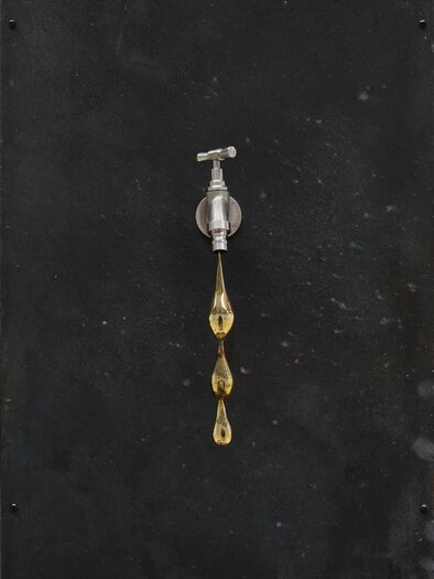 A faucet on a dark wall. Golden drops hang from the outlet. | © (c)Jean-Christophe Lett