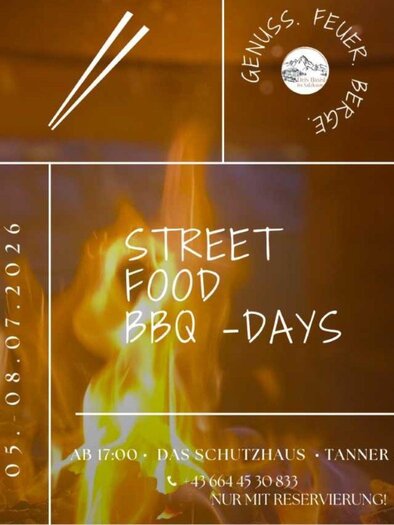 The flyer describes the Street Food & BBQ Days from July 5 - 8, 2026. In the background of the text, there is an image of a burning fire. | ©  Schutzhaus, Bad Aussee, www.schutzhaus-ausseerland.at