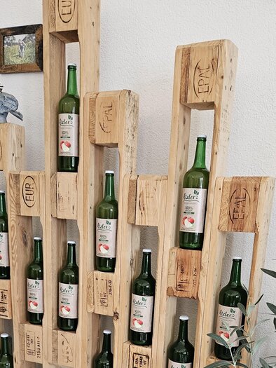 Juices at Atzler's Hofspezialitäten, decoratively presented in the interior of the farm shop in Maria Lankowitz.
