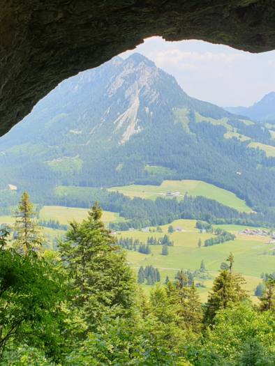 <p>A view from a cave, the Lieglloch is an impressive natural cave above Tauplitz, overlooking a green landscape with mountains in the background. Nature is lush and invites exploration.</p> | © Daniela Casari