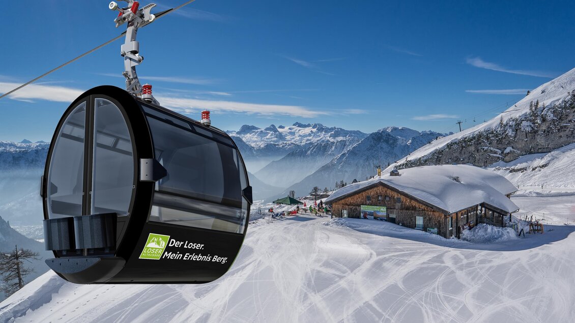Eine Gondelbahn fährt über verschneite Berge. Im Hintergrund ist eine Berghütte zu sehen. | © Porsche Design Studio