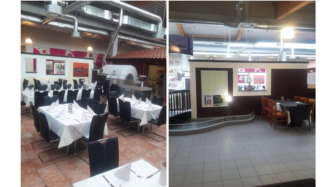 Ein Restaurant mit eleganten schwarzen Stühlen und weißen Tischdecken ist zu sehen. Im Hintergrund sind Kunstwerke und eine offene Küche zu erkennen. | © Pizzeria Ristorante La Piazza