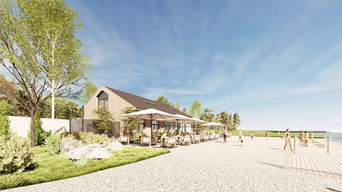 Ein modernes Strandhaus mit Terrassen und Sonnenschirmen. Der Strand ist einladend und die Umgebung ist grün mit einigen Bäumen. | © Renering_Thorhof