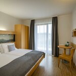 Photo of double room with balcony | © JUFA Hotel Deutschlandsberg