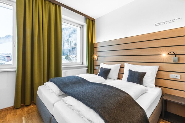 doppelbett-familienzimmer-jufa-hotel-schladming-la | © JUFA Hotel Schladming